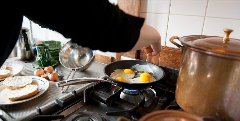 Egg breakfast being prepared in a kitchen.