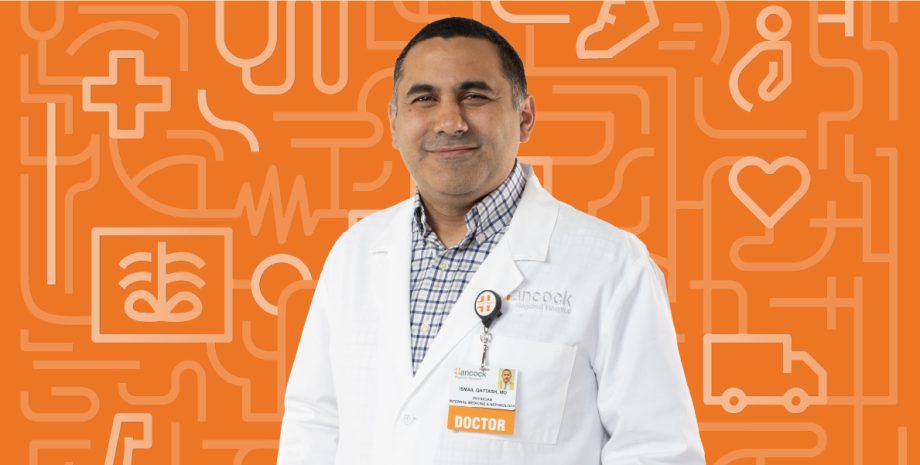 A photo of Doctor Qattach in front of an orange background.